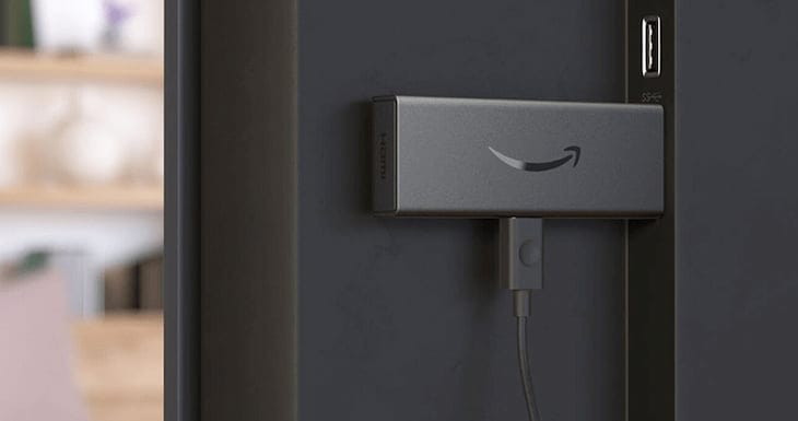 Amazon Fire TV Stick plugged into the back of a TV, highlighting its simple plug-and-play setup