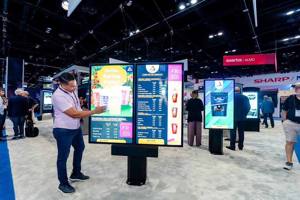 Attendee uses a digital signage display at DSE exhibit hall