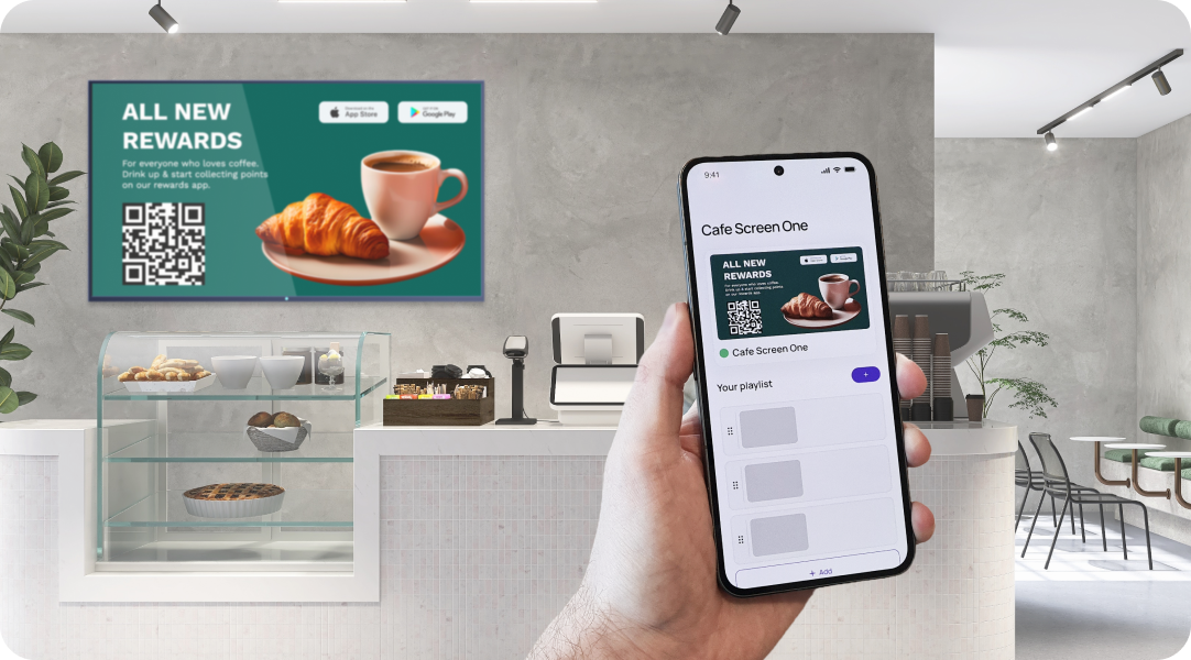 Hand holding a phone with the Fugo app, updating digital signage content on a café screen.