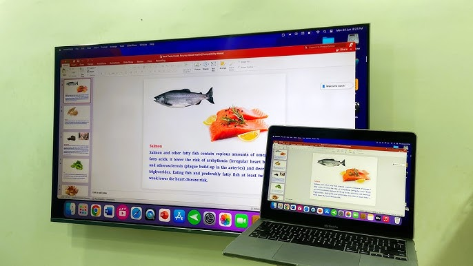 Laptop showing a Power BI presentation embedded in PowerPoint, mirrored to a TV screen.